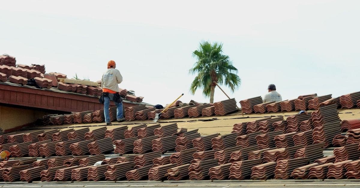 SIA Roofing team repairing roof tiles on a Melbourne home